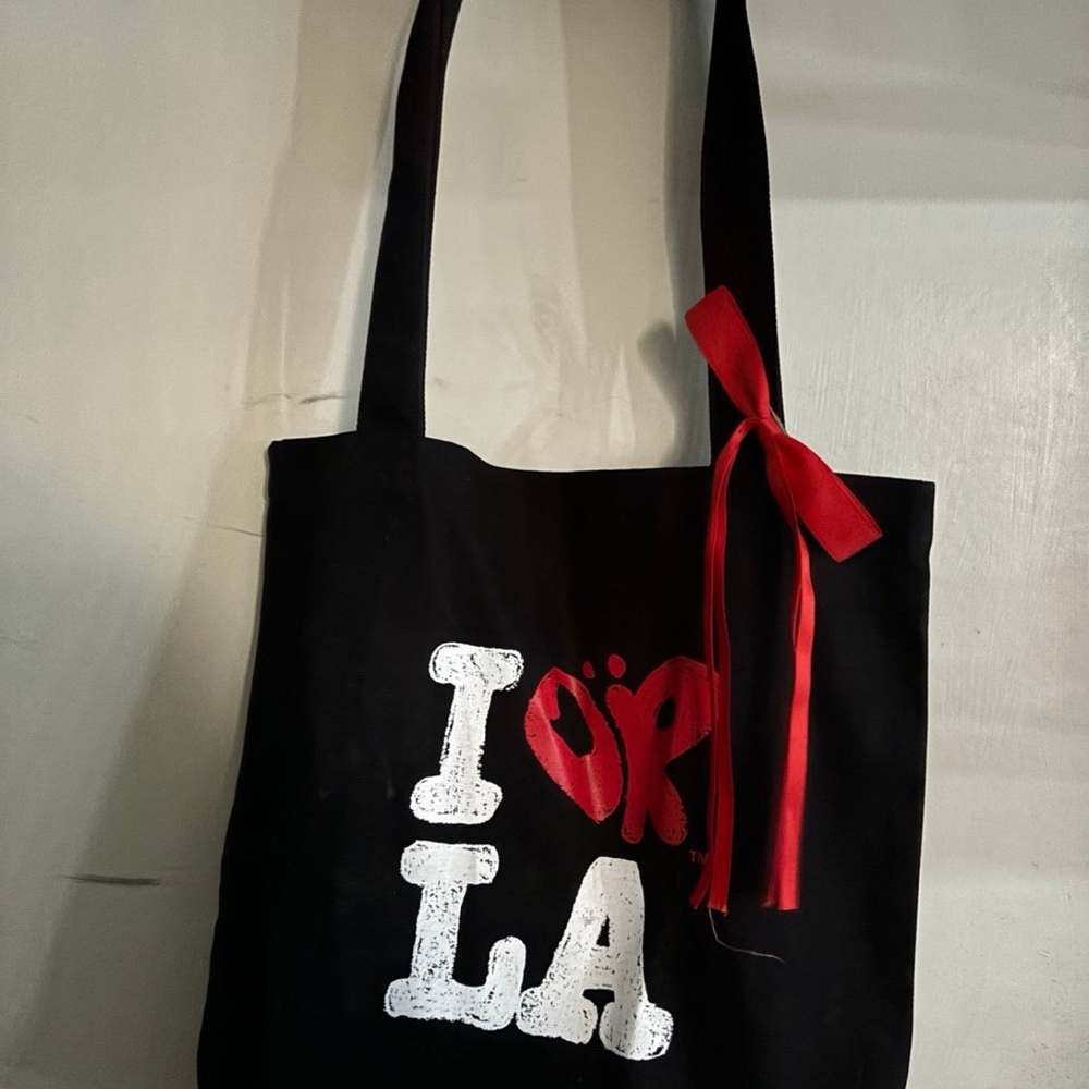 Chic Black Tote with Red Ribbon Accent
